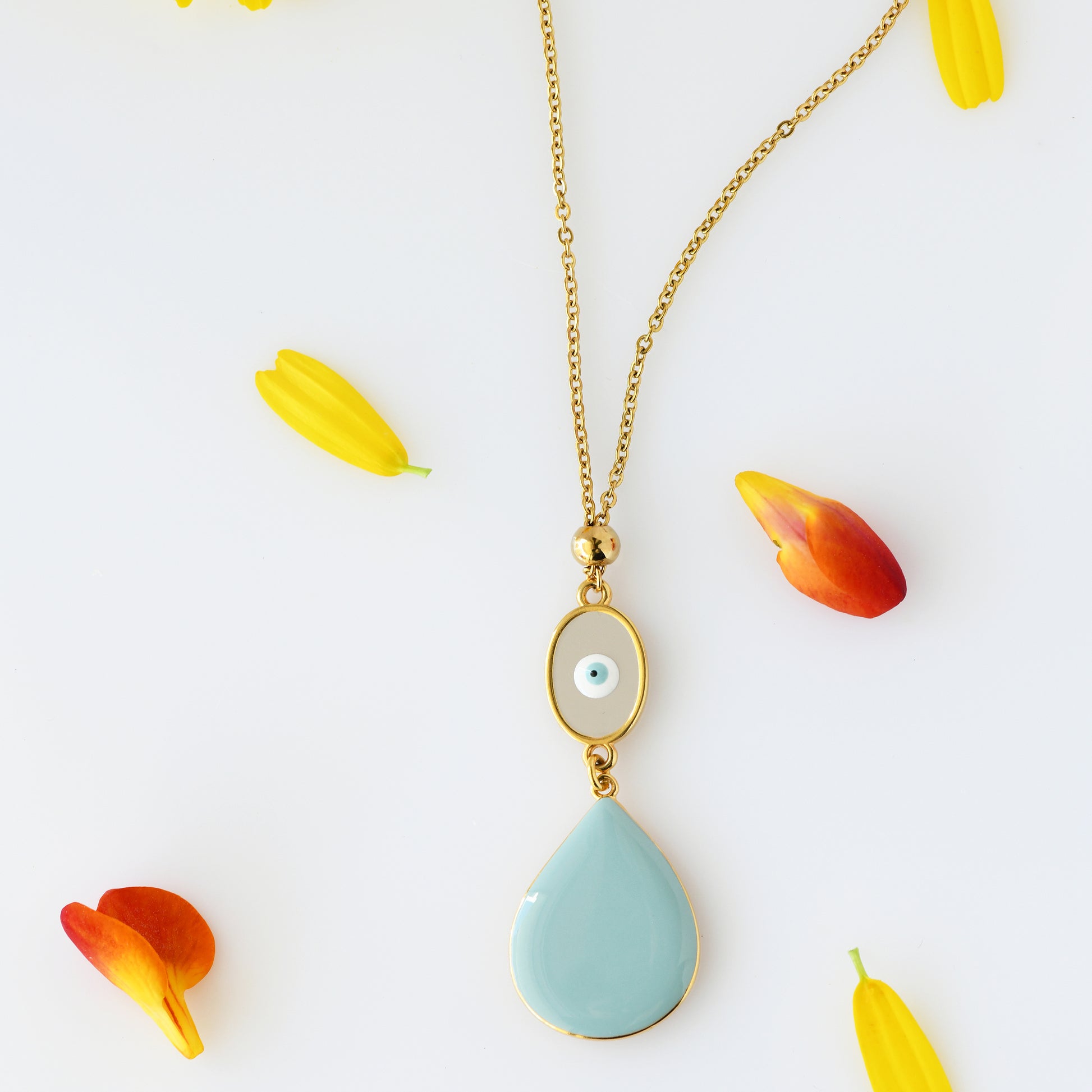 24k gold plated necklace with light blue pendant and small eye